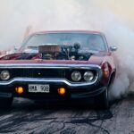 Classic American Muscle Car has Burn-out Race